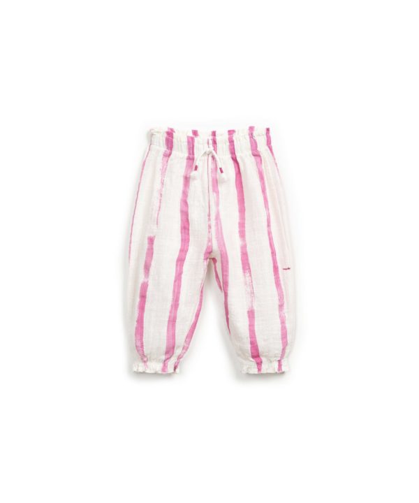 Trousers with decorative drawstring